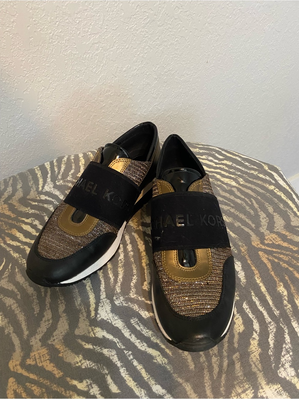Michael Kors Black and Gold Slip-On Athletic Sneakers